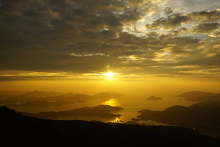 landscape photography of sea covered mountains thumbnail