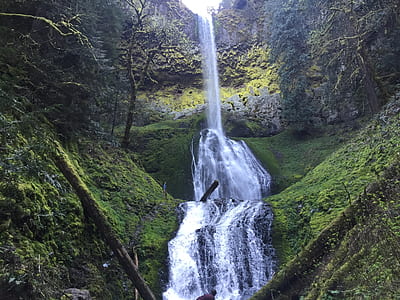 waterfalls surrounded by rocks thumbnail