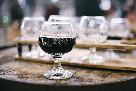selective focus photo of clear footed glass thumbnail