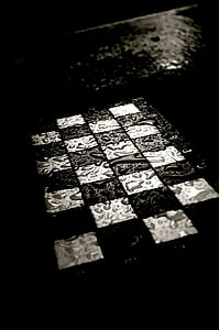 grayscale photo of checked board with water thumbnail