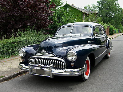 black classic car on road thumbnail