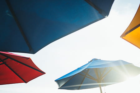 blue, red, and yellow parasol during daytime thumbnail