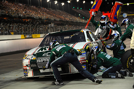 white and green Chevrolet Impala stock car thumbnail