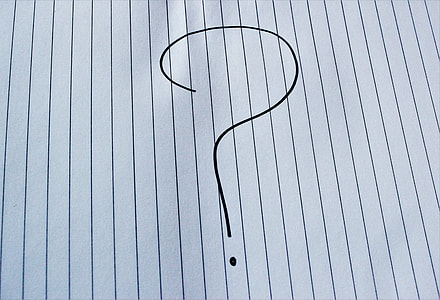 question mark handwritten symbol on blue lined paper thumbnail