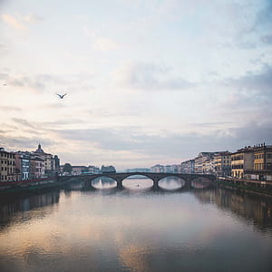 A bridge over Arno river in Florence, Italy at sunset thumbnail