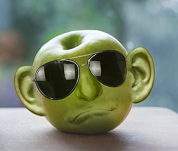 green apple formed into face with sunglasses thumbnail