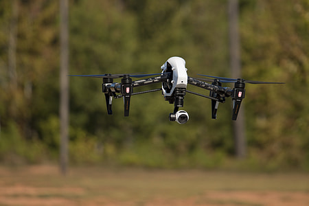 selective focus photo of white and black quadcopter drone thumbnail