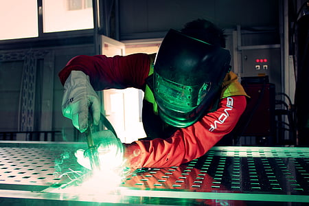 man wearing black welding mask thumbnail