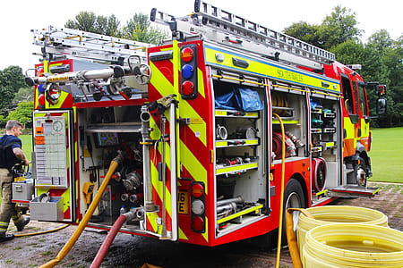 man about to walk beside firetruck thumbnail