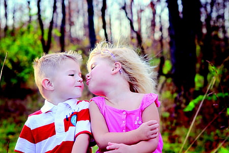 girl and boy near on green leafed plants during daytime thumbnail