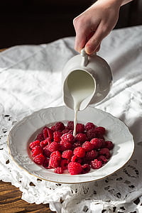 raspberries on white ceramic plate thumbnail