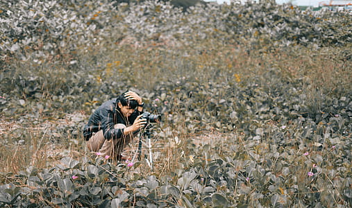 Man Taking Photo Using Dslr Camera thumbnail