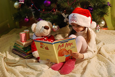 girl in white sweater reading book thumbnail