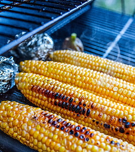 four grilled corn cobs on grill thumbnail