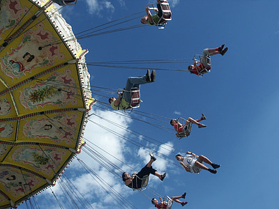 group of people riding hanging swing carnival ride thumbnail