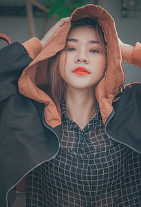 Woman Wearing Brown and Black Hoodie Jacket thumbnail