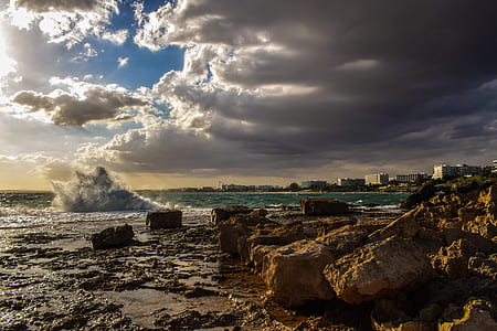 rocks near body of water thumbnail