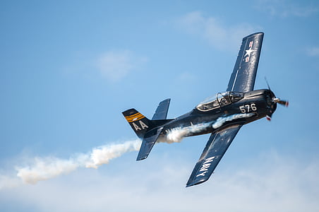 blue Navy monoplane on sky thumbnail