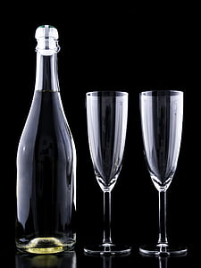 two clear flute champagne glasses and bottle thumbnail