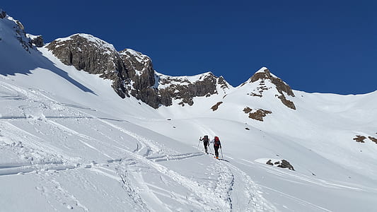 two people trekking in snow mountain thumbnail