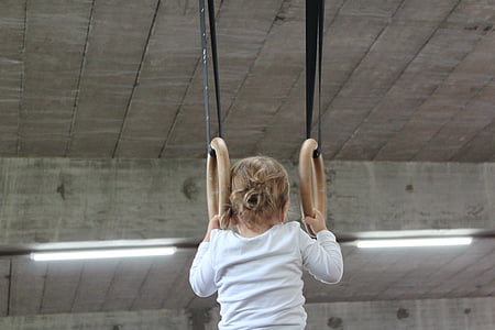 girl performing acrobatic inside room thumbnail