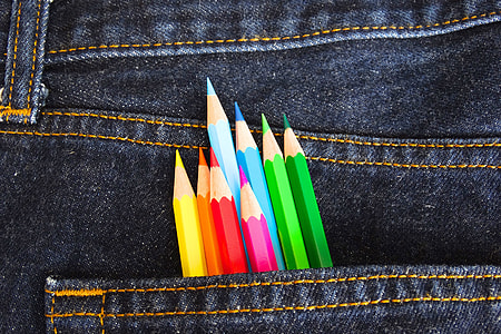 Denim fabric school jeans with colored pencils thumbnail
