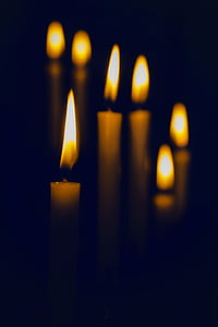 lit white candles thumbnail