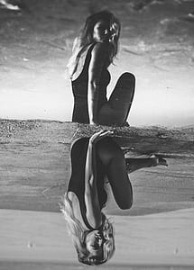 woman seating on sands thumbnail