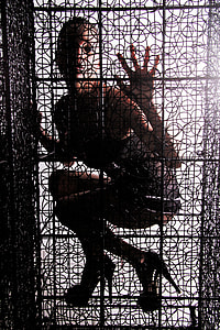 caged photo of woman wearing heeled shoes thumbnail