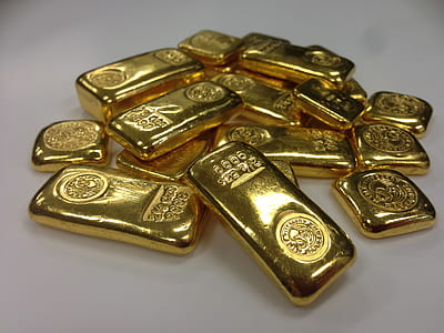 gold bar lot on white surface thumbnail
