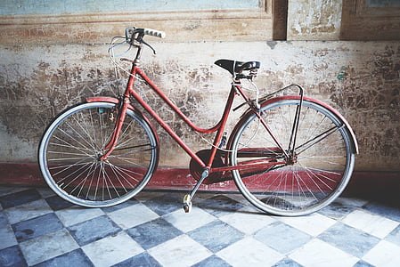 bike parked beside wall inside building thumbnail