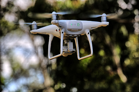 white quadcopter soaring on air thumbnail