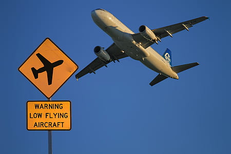 beige monoplane during daytime photo thumbnail