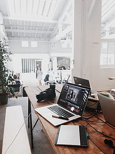 Turned-on Gray Laptop Computer on Table thumbnail
