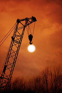 silhouette of crane during golden hour thumbnail