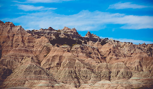brown rocky mountain under blue sky thumbnail