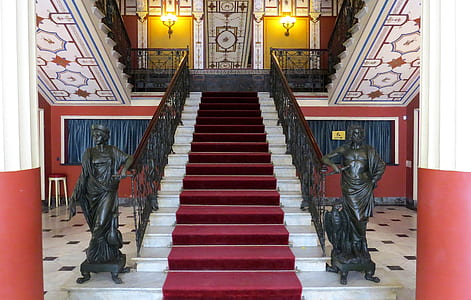 maroon carpet on white staircase thumbnail