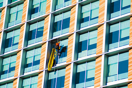 person cleaning window glass of the building thumbnail