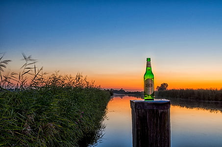 green bottle on top of pillar thumbnail