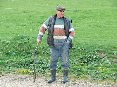man holding gray pickaxe thumbnail