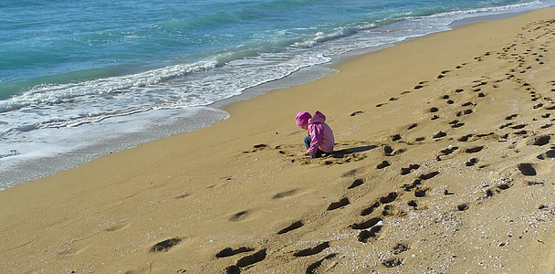 girl seating on the seashore thumbnail