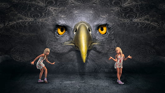 two girls standing at the front of eagle face wall thumbnail