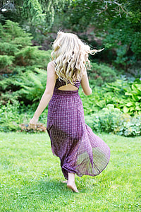 woman in purple sleeveless dress running on green grass thumbnail