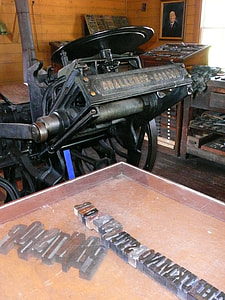 black metal industrial machine near the brown wooden wall thumbnail
