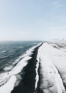 body of water under white clouds and blue sky thumbnail