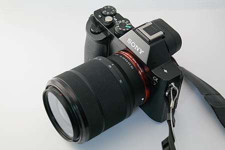 black Sony DSLR camera on white surface thumbnail
