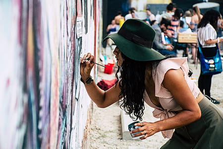 Photo of Woman Painting on Wall thumbnail