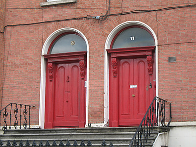 two red doors near staircase thumbnail