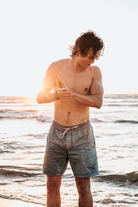 man stands near seashore thumbnail