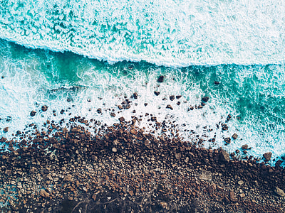 bird's-eye view of body of water on seashore thumbnail